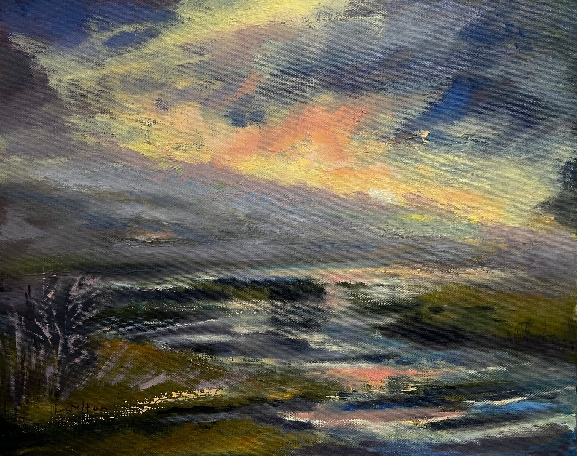 Brilliant river sunset scene with reflections on the wetlands water.