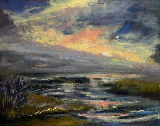 Brilliant river sunset scene with reflections on the wetlands water.